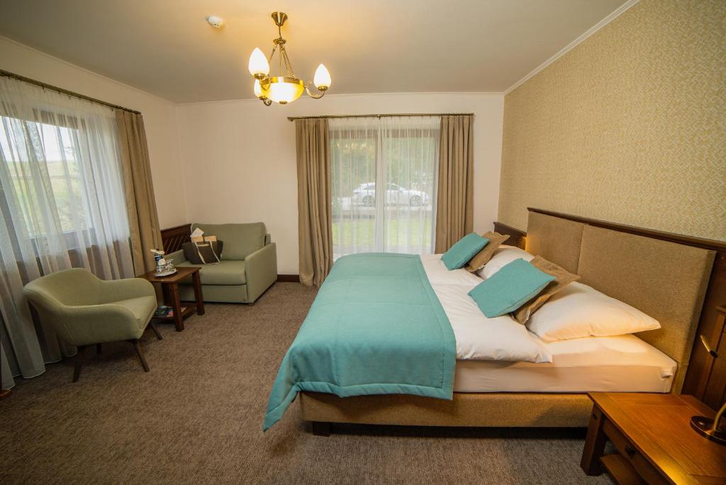 Postel nebo postele na pokoji v ubytování Oravský Háj Garden Hotel & Resort