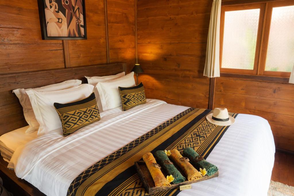 Ένα ή περισσότερα κρεβάτια σε δωμάτιο στο Kayu Village
