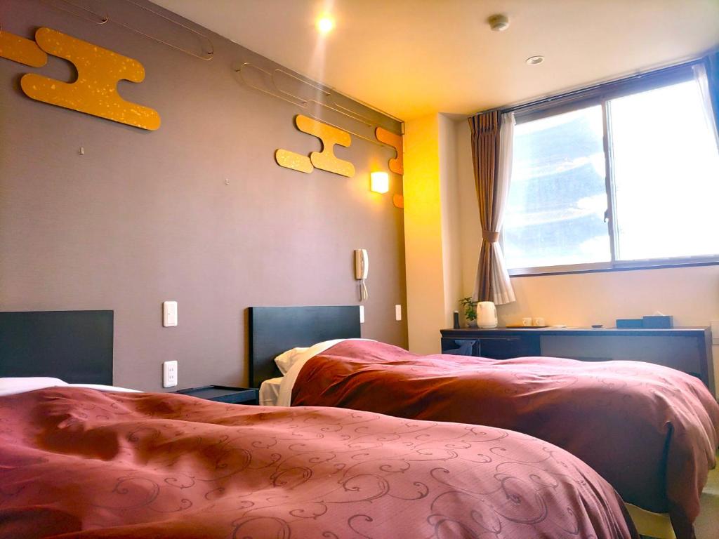 Postel nebo postele na pokoji v ubytování PREMIUM TOJI