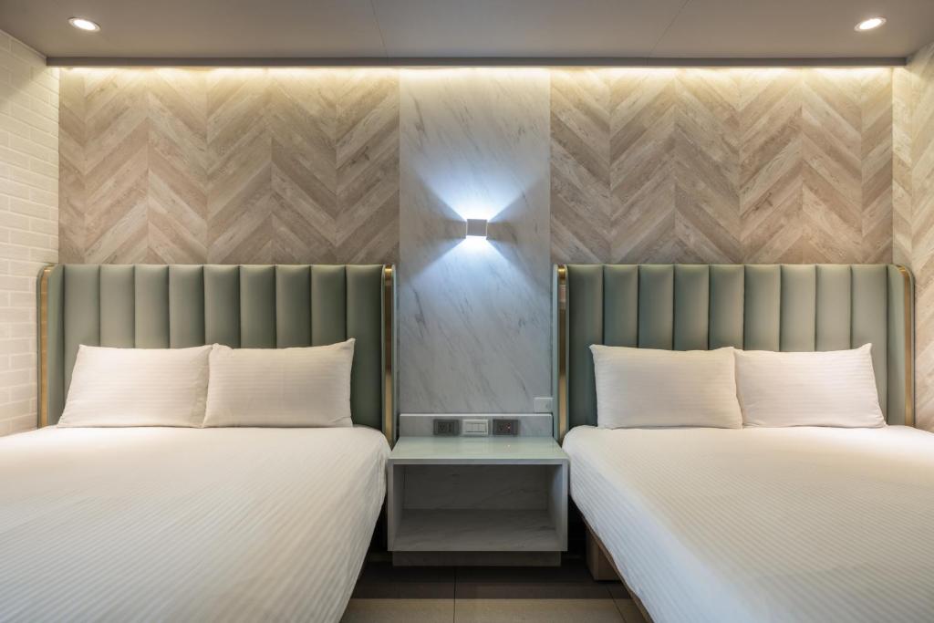 Postel nebo postele na pokoji v ubytování S&E Hotel