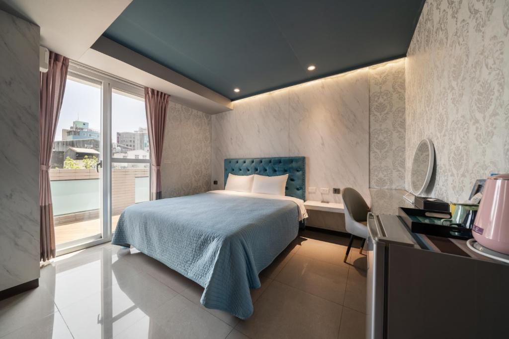 Postel nebo postele na pokoji v ubytování S&E Hotel