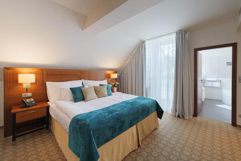Postel nebo postele na pokoji v ubytování Hotel Silenzio