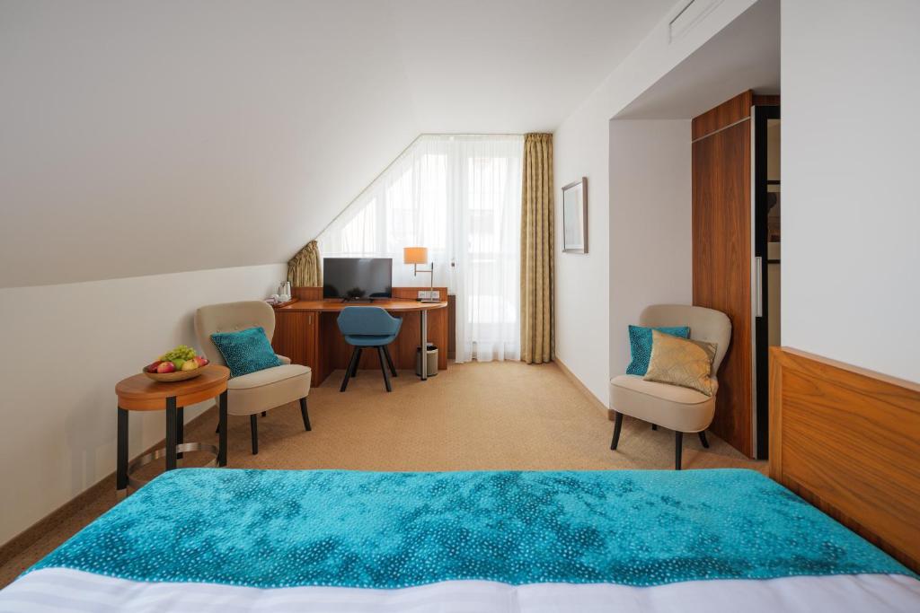 Postel nebo postele na pokoji v ubytování Hotel Silenzio