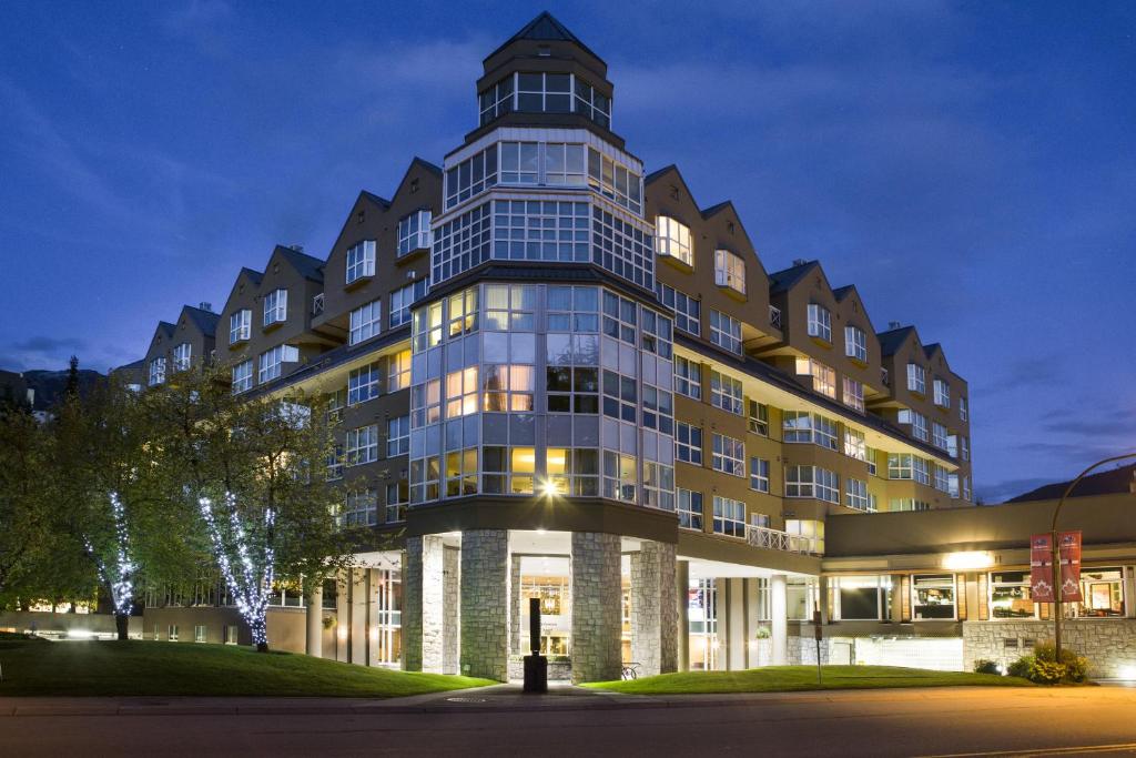 a large building with a tower on top of it at Le Chamois by Whistler Premier in Whistler