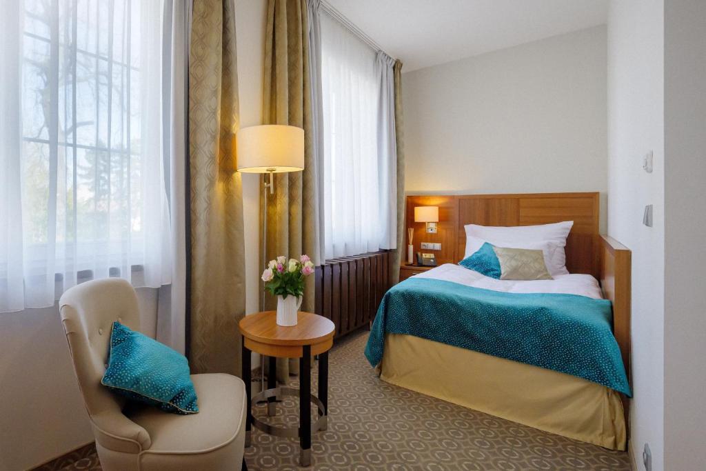 Postel nebo postele na pokoji v ubytování Hotel Silenzio