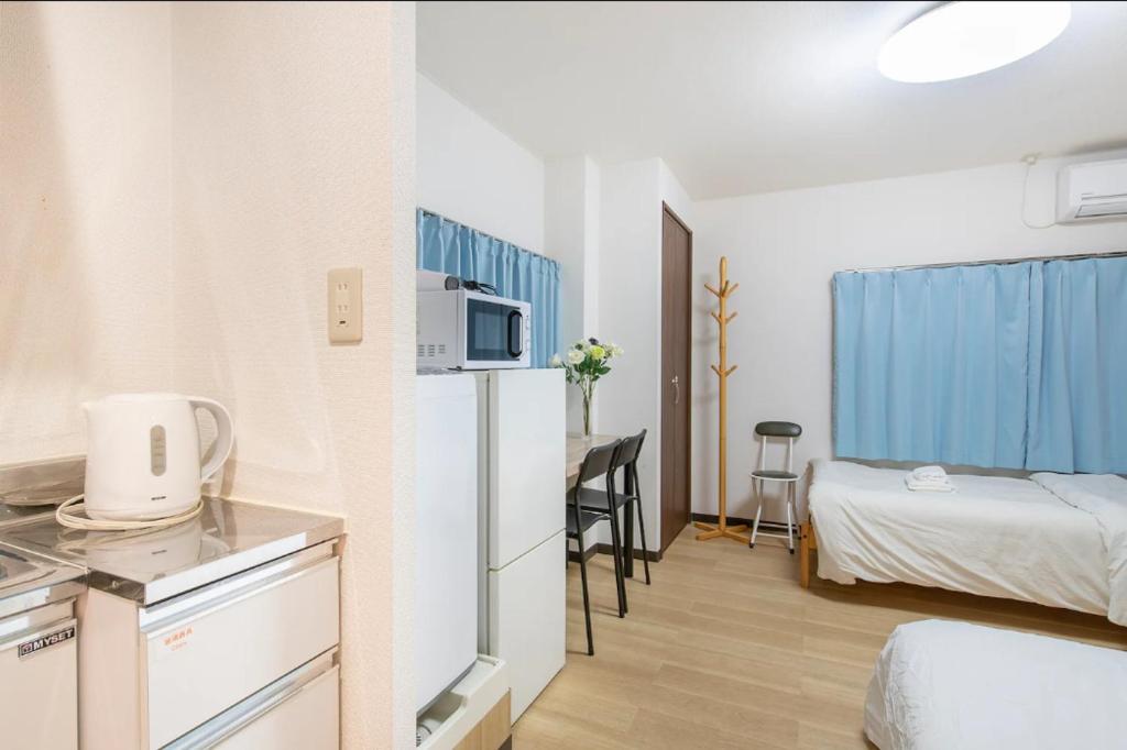 Kuchyň nebo kuchyňský kout v ubytování Uhome Tabata Apartment