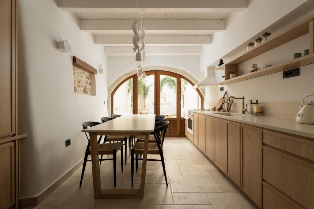 Kuchyň nebo kuchyňský kout v ubytování Cortiletto Timeless Suites