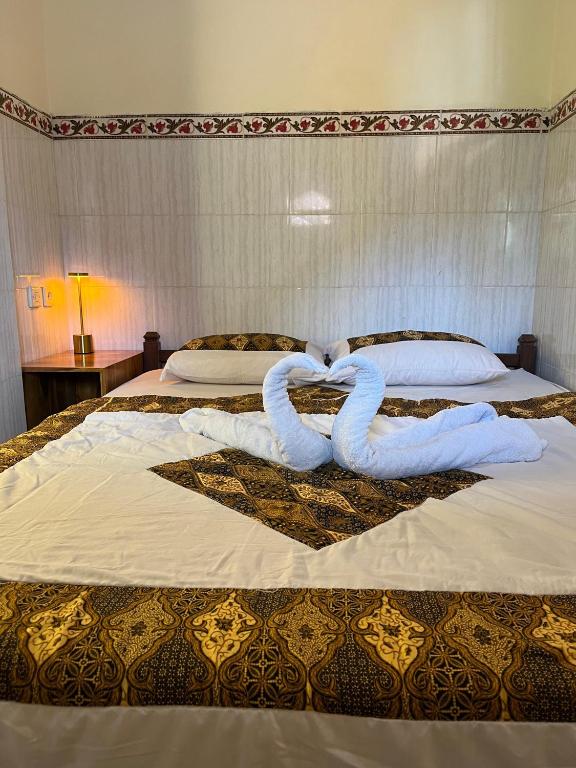 Postel nebo postele na pokoji v ubytování Tutde's House