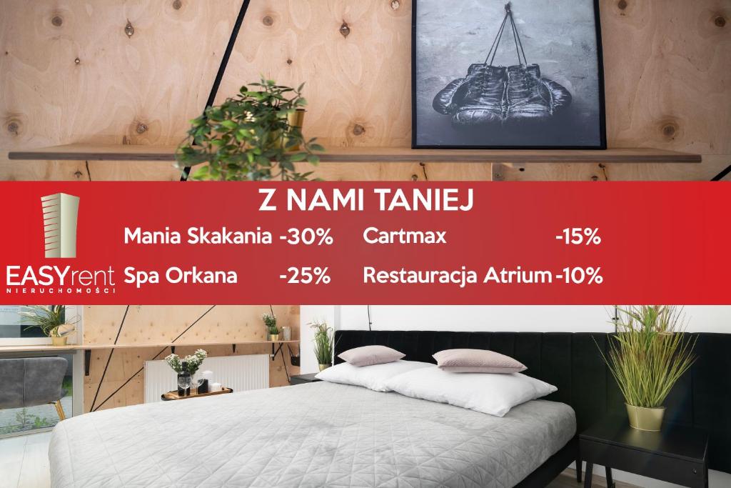 een poster voor een winkel met een bed in een kamer bij EASY RENT Apartments - Smart 5 in Lublin