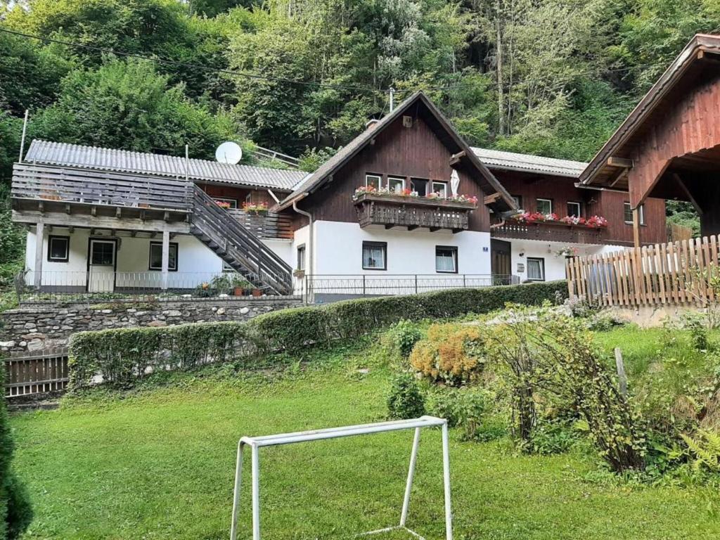 a house with a soccer ball in the grass at Holiday apartment in Feld am See in Carinthia in Feld am See