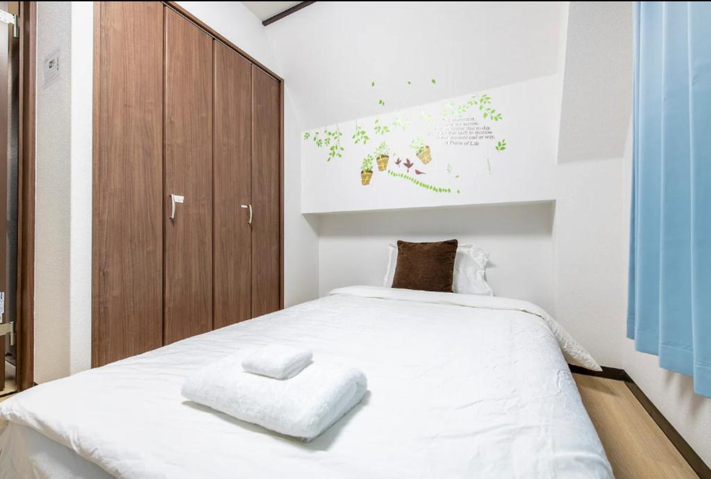 Postel nebo postele na pokoji v ubytování Uhome Tabata Apartment