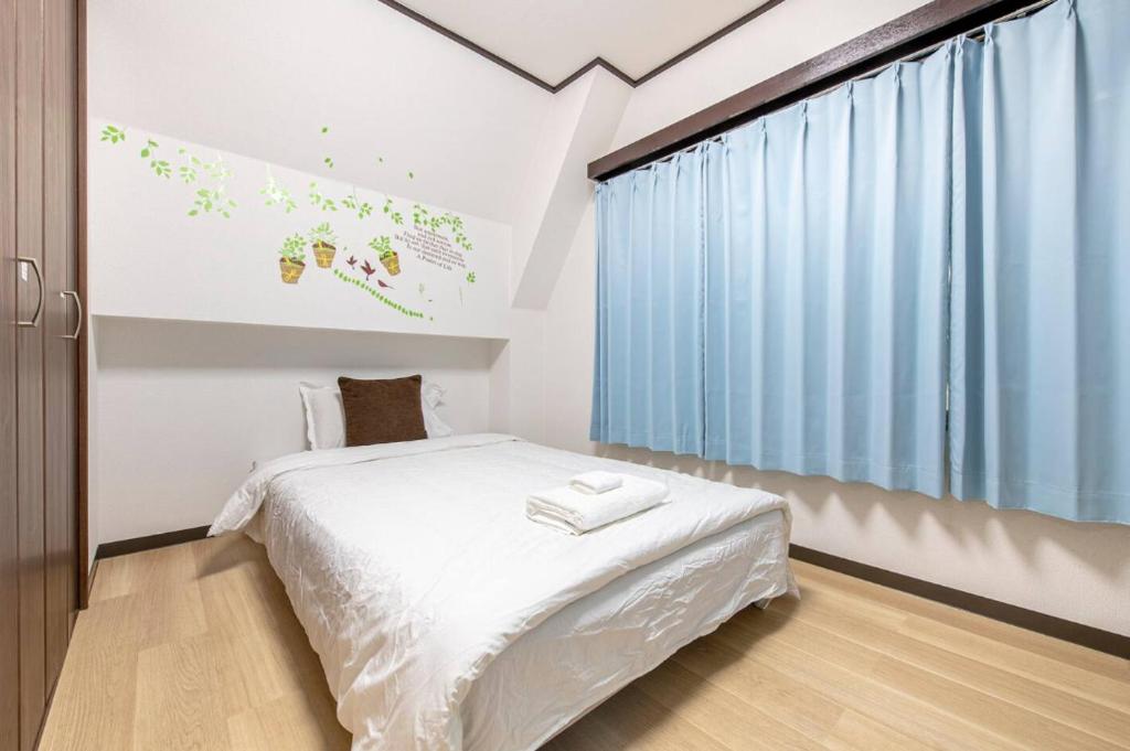 Postel nebo postele na pokoji v ubytování Uhome Tabata Apartment