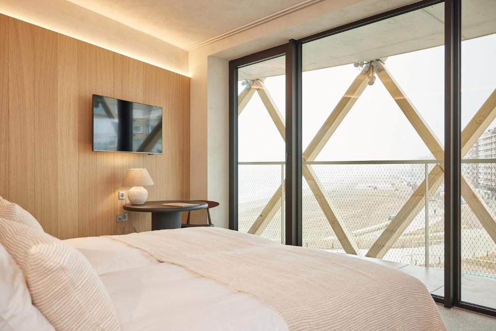Postel nebo postele na pokoji v ubytování C-Hotels Silt