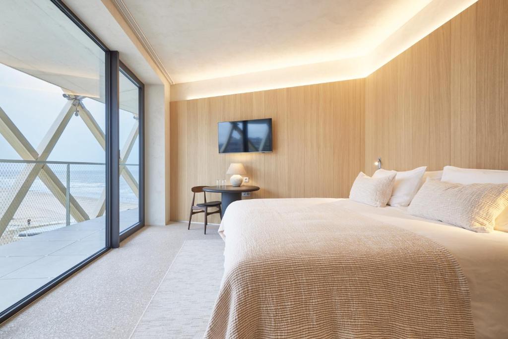 Postel nebo postele na pokoji v ubytování C-Hotels Silt