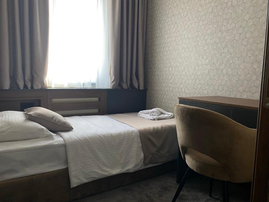 Postel nebo postele na pokoji v ubytování Hotel Stari Krovovi
