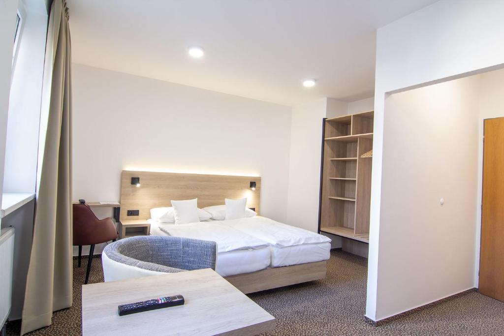 Postel nebo postele na pokoji v ubytování Hotel Avion