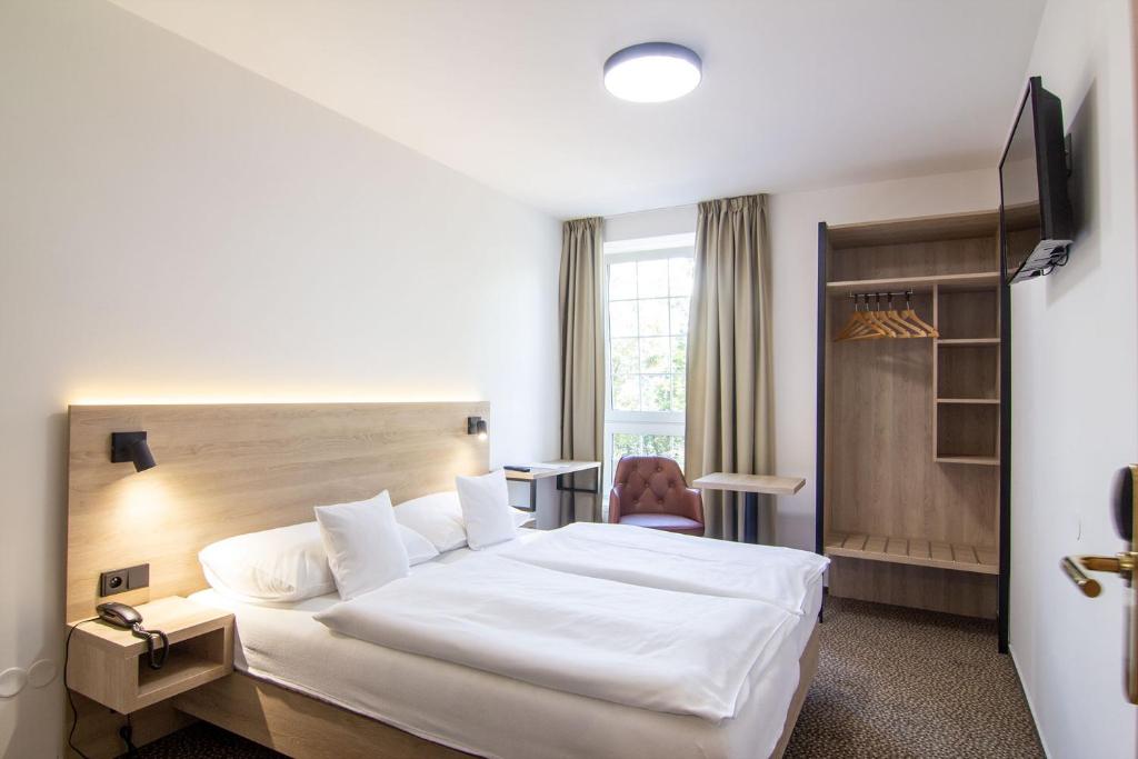 Postel nebo postele na pokoji v ubytování Hotel Avion