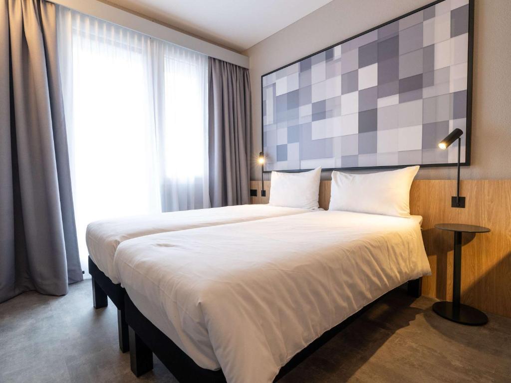 Postel nebo postele na pokoji v ubytování ibis Chur