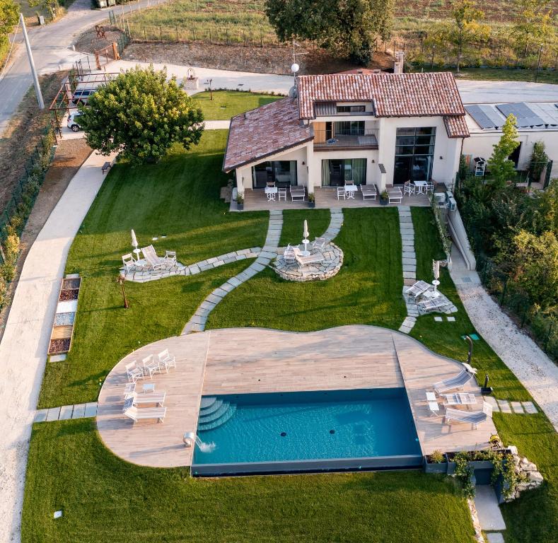 an aerial view of a house with a swimming pool at Il Viaggio Impresa Sociale in Bicchignano
