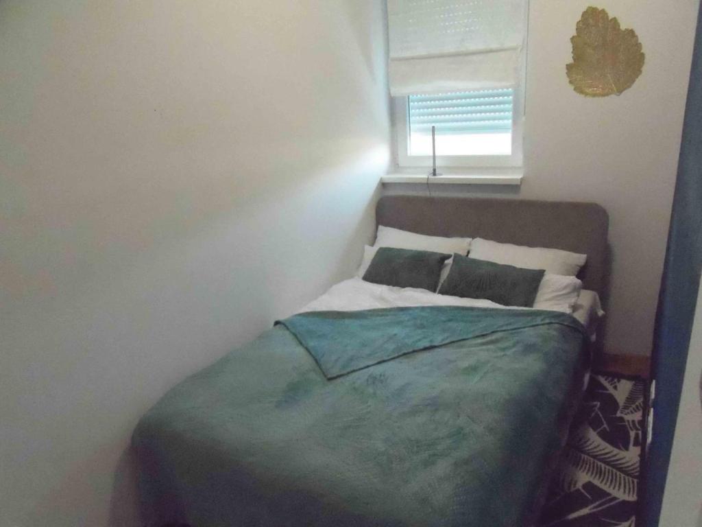 Posteľ alebo postele v izbe v ubytovaní Apartmani 6M i M5