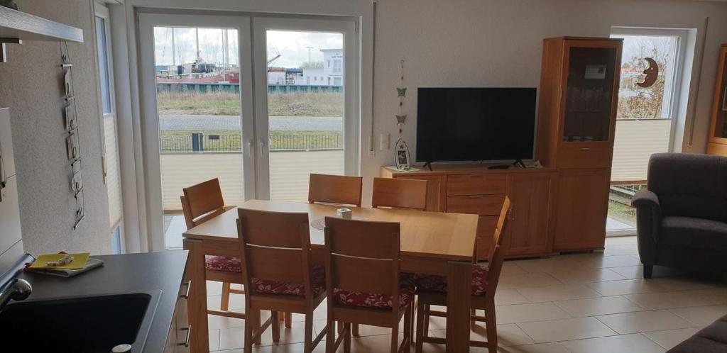 TV a/nebo společenská místnost v ubytování Haus am Leuchtfeuer A