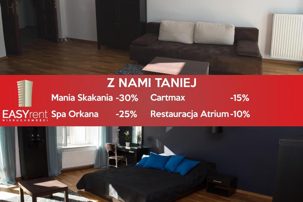 a poster for a room with a bed and a couch at EASY RENT Apartments - Konopnicka 11, Centrum 24h Check-in in Lublin