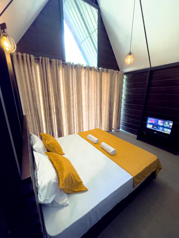 Postel nebo postele na pokoji v ubytování Eco Knuckles Holiday Lodge