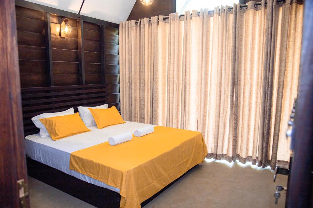 Postel nebo postele na pokoji v ubytování Eco Knuckles Holiday Lodge