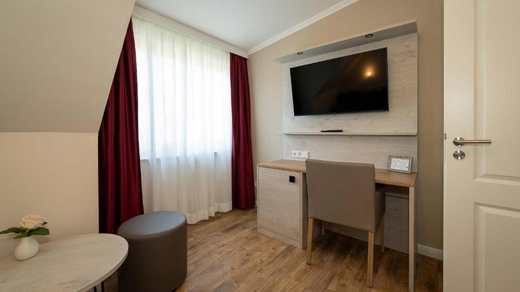 TV a/nebo společenská místnost v ubytování Hotel Rosengarten