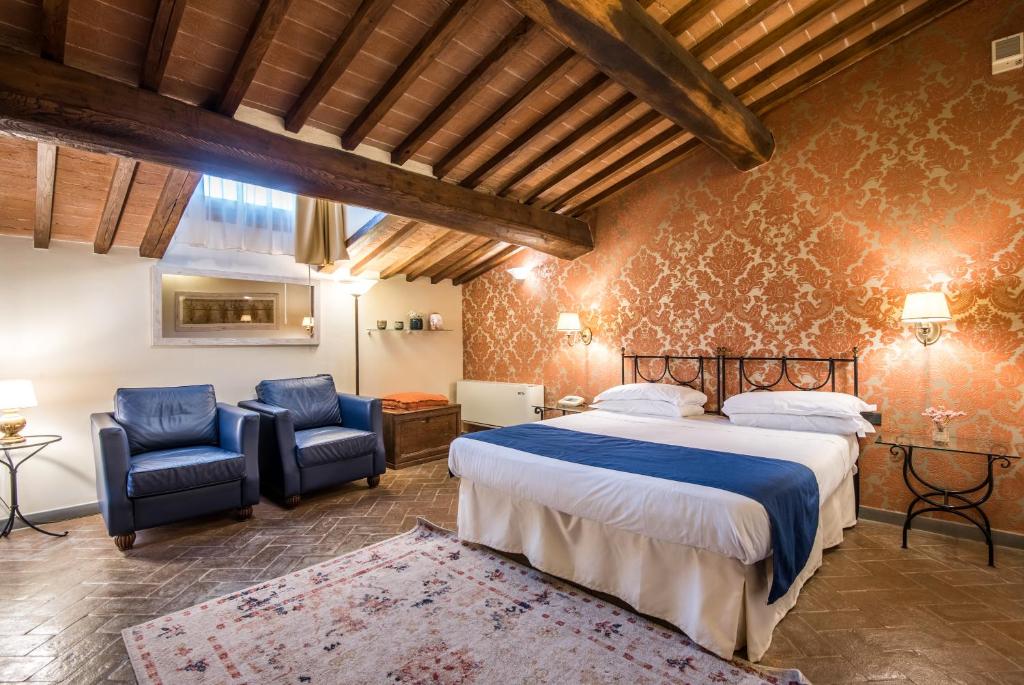 Postel nebo postele na pokoji v ubytování Hotel Palazzo Squarcialupi