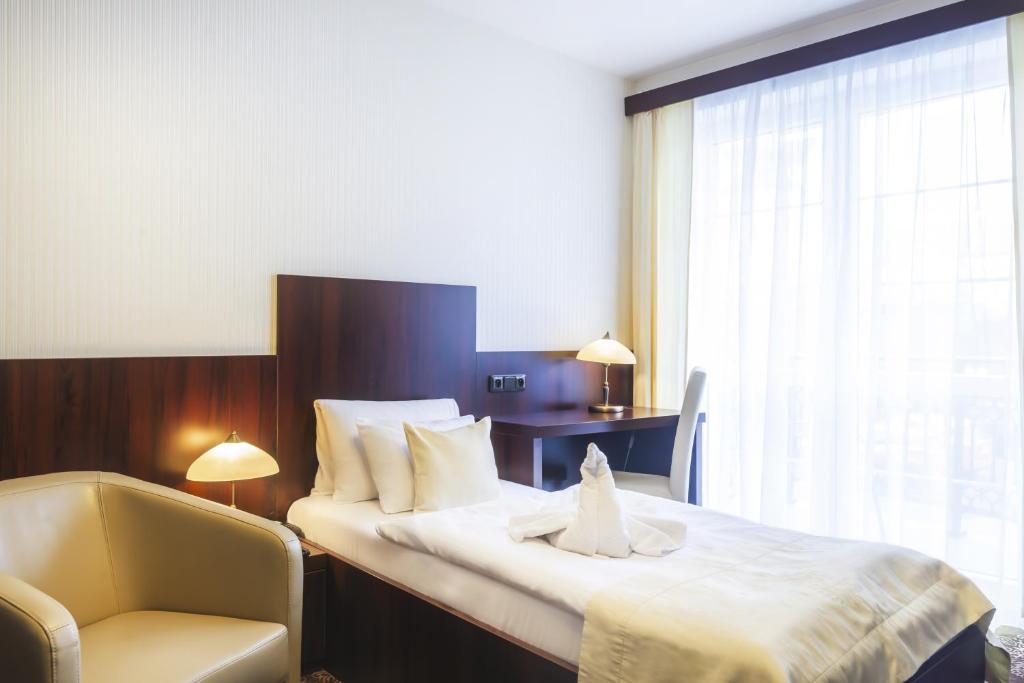 Postel nebo postele na pokoji v ubytování Spa Hotel Diana