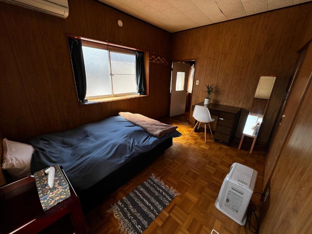 Postel nebo postele na pokoji v ubytování Guesthouse Azumaya