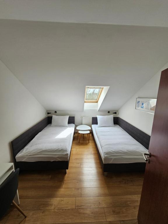 Postel nebo postele na pokoji v ubytování Hotel Mlyn