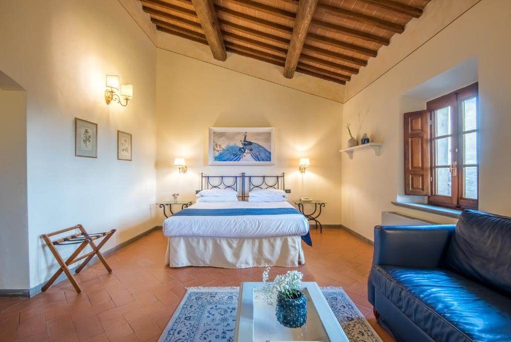 Postel nebo postele na pokoji v ubytování Hotel Palazzo Squarcialupi