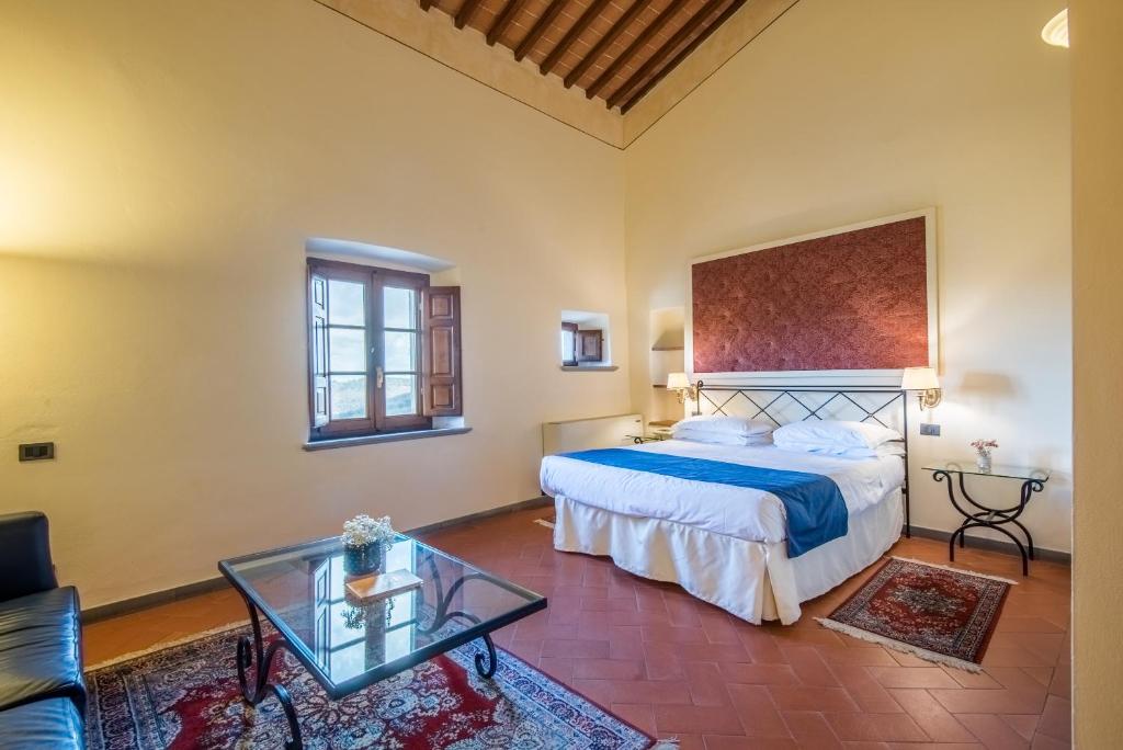 Postel nebo postele na pokoji v ubytování Hotel Palazzo Squarcialupi