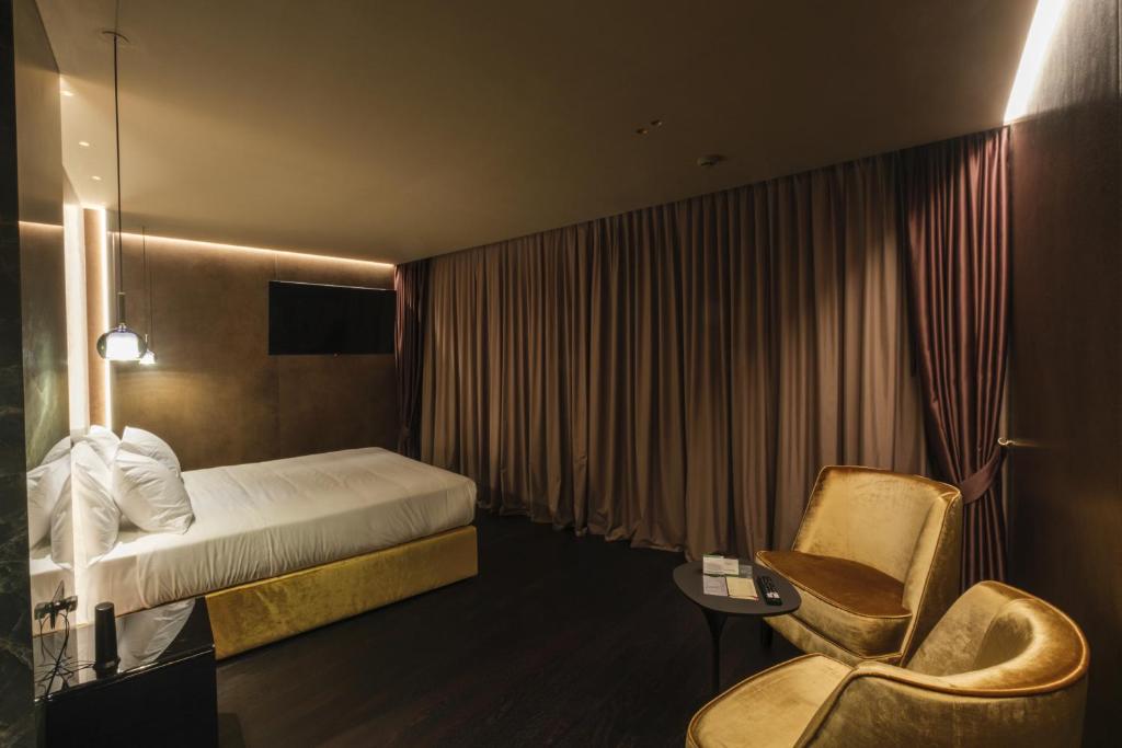 Postel nebo postele na pokoji v ubytování Hotel Touring