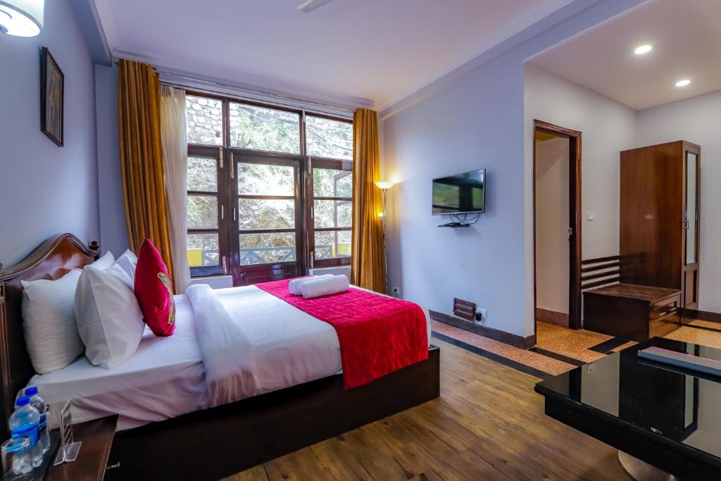 Postel nebo postele na pokoji v ubytování Green N Breeze Resorts Mussoorie