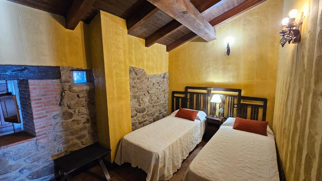 Postel nebo postele na pokoji v ubytování La Clerecia de Ledesma