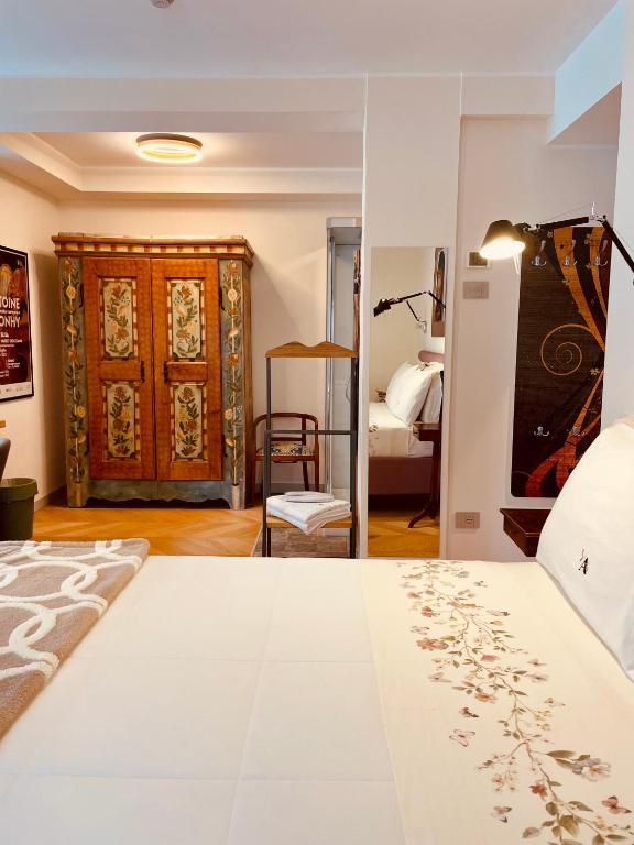 Postel nebo postele na pokoji v ubytování d'ARTEmisia Chambres d'hôtes