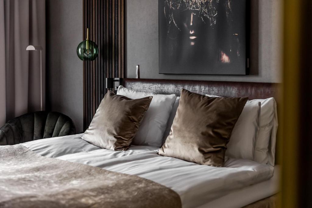 Postel nebo postele na pokoji v ubytování xhotel