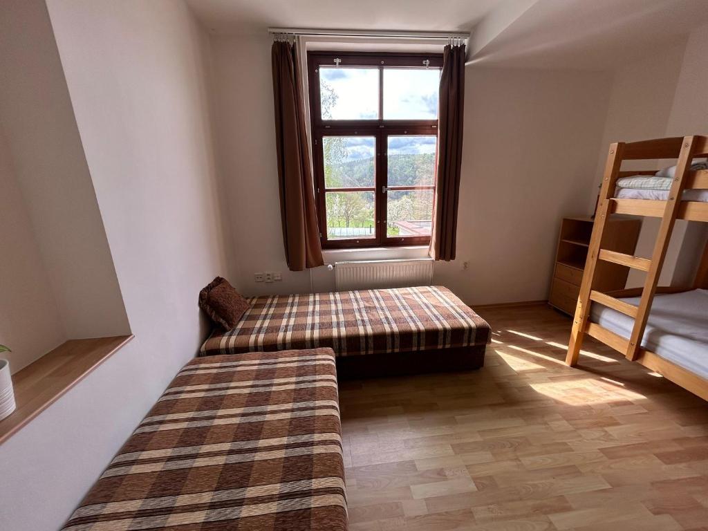 Postel nebo postele na pokoji v ubytování Penzion Maják