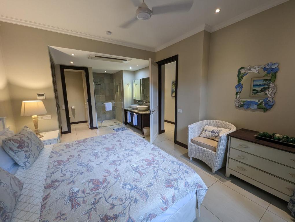 Postel nebo postele na pokoji v ubytování Papay Suite by Simply-Seychelles