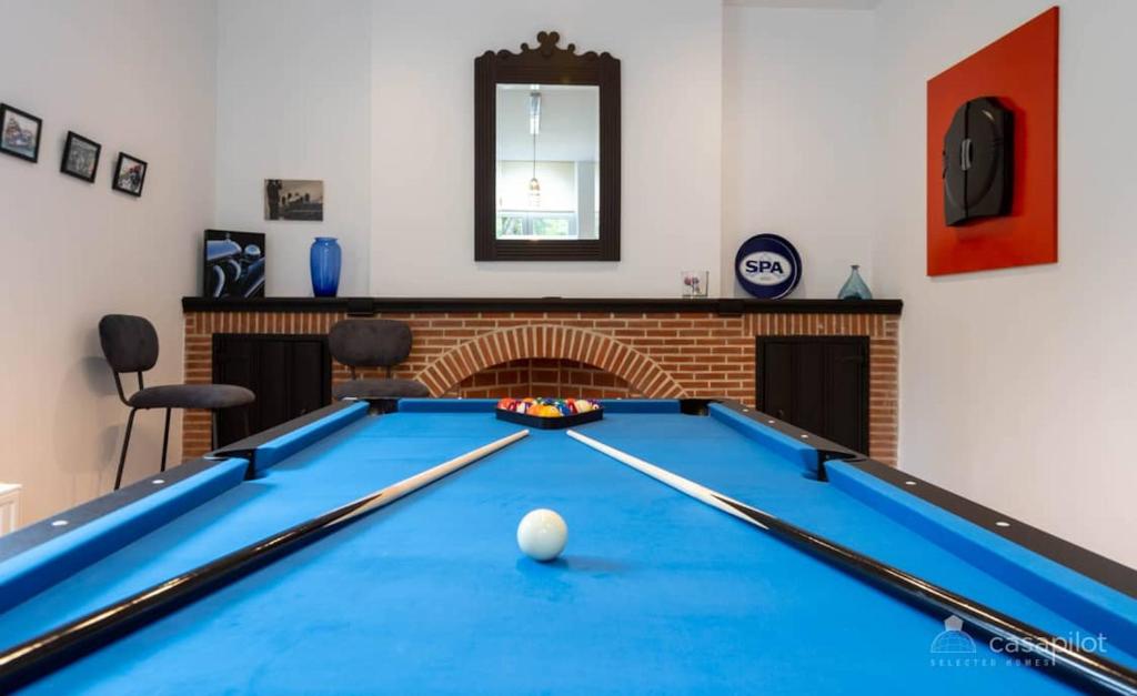 a pool table with a ball in the middle of it at 5 bedrooms house with city view jacuzzi and enclosed garden at Spa in Spa