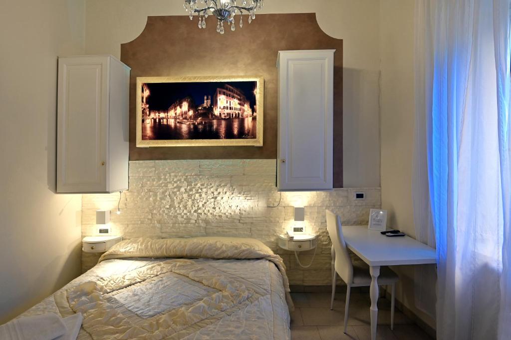 Postel nebo postele na pokoji v ubytování Hotel Central Giacomini