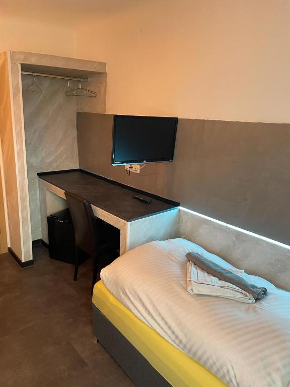 Postel nebo postele na pokoji v ubytování Etna Hotel & Ristorante