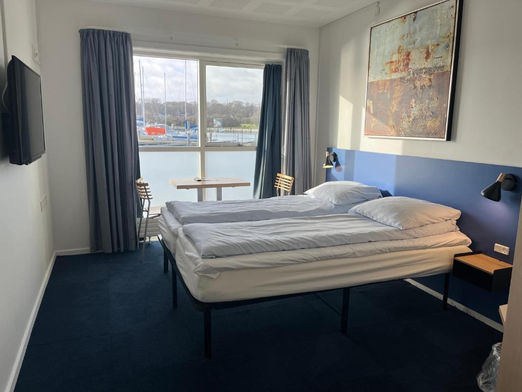 Postel nebo postele na pokoji v ubytování BB-Hotel Aarhus Havnehotellet