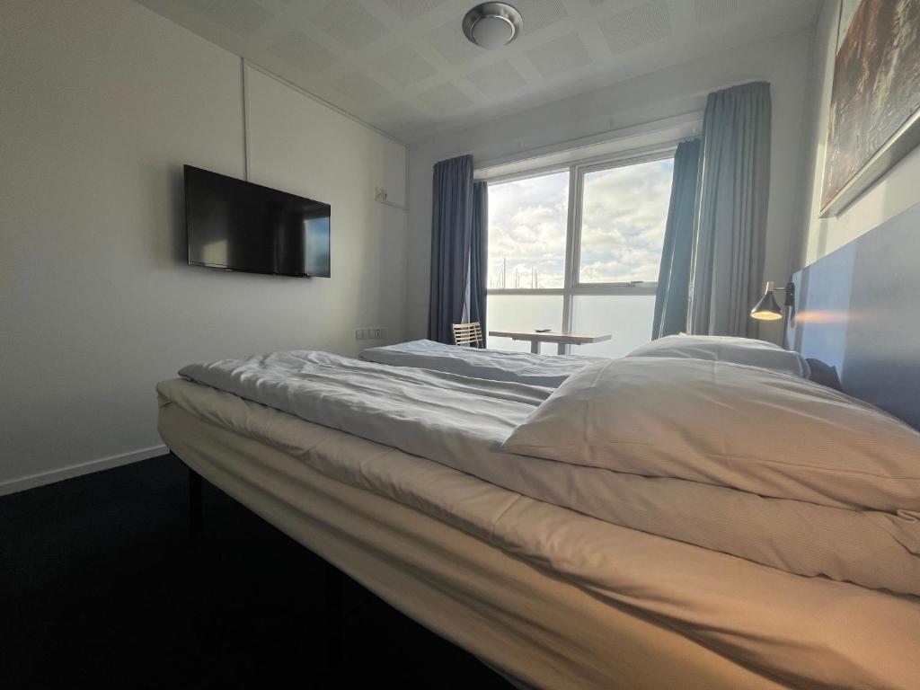 Postel nebo postele na pokoji v ubytování BB-Hotel Aarhus Havnehotellet