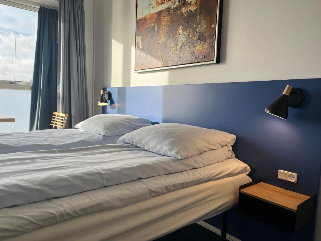 Postel nebo postele na pokoji v ubytování BB-Hotel Aarhus Havnehotellet