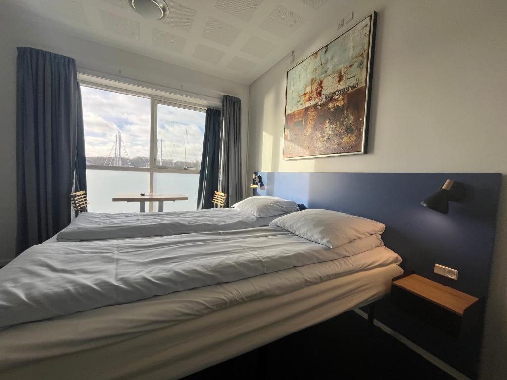 Postel nebo postele na pokoji v ubytování BB-Hotel Aarhus Havnehotellet