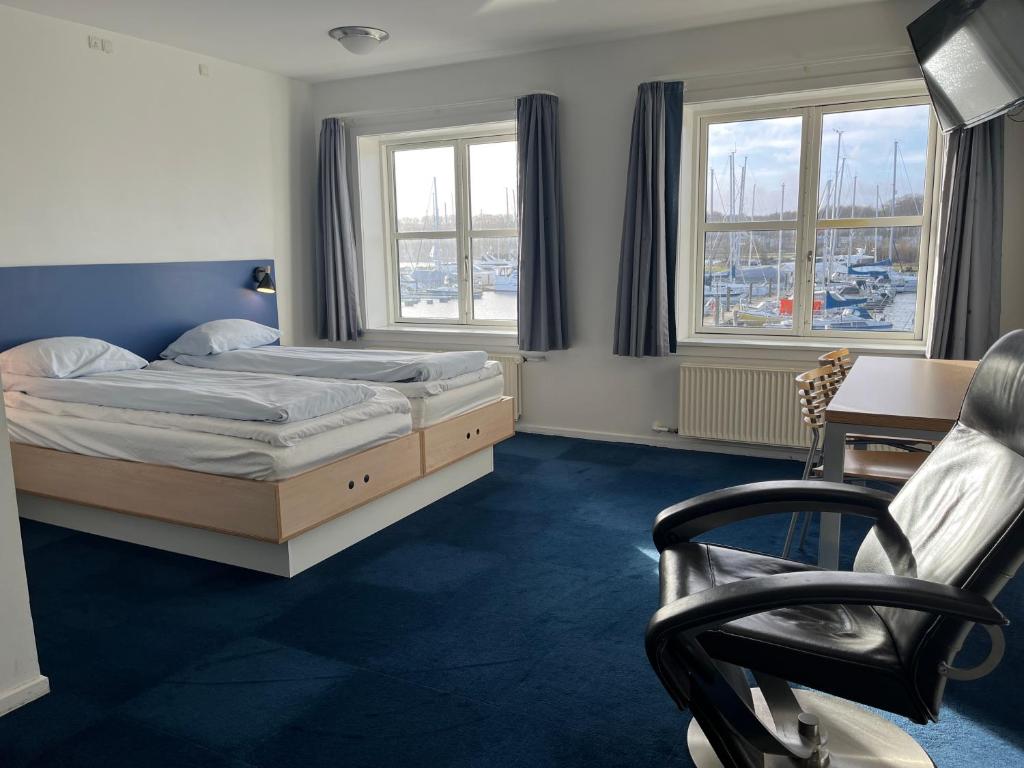 Postel nebo postele na pokoji v ubytování BB-Hotel Aarhus Havnehotellet